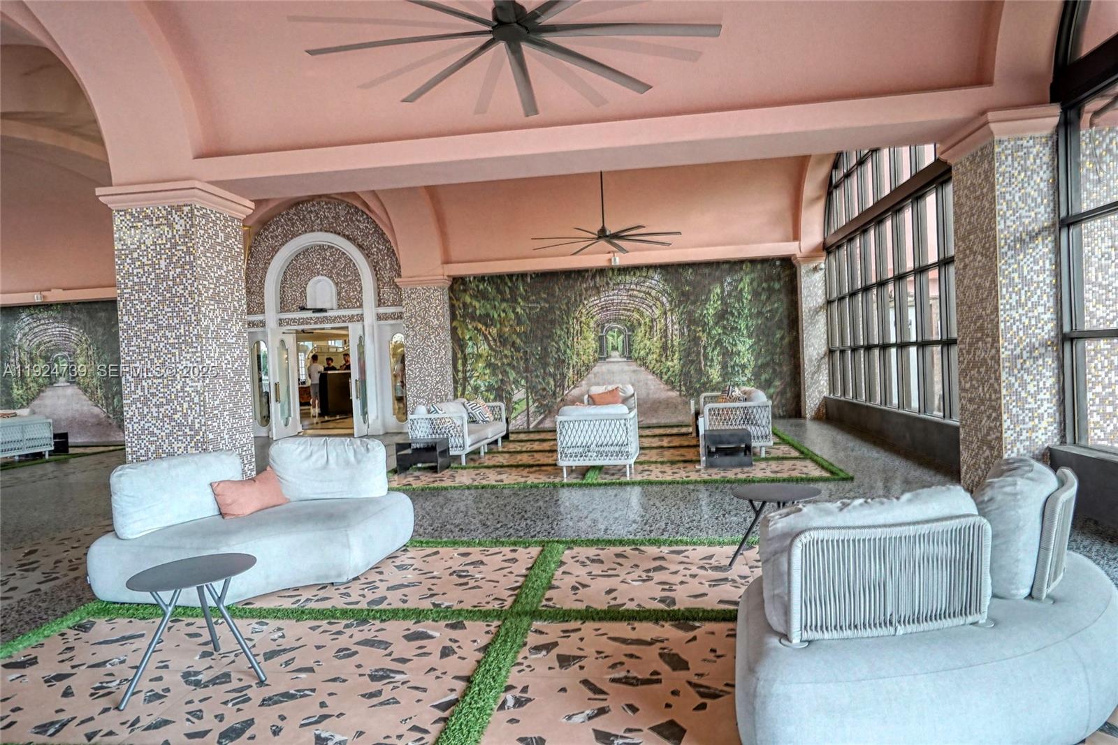 5225 Collins Avenue, Unit 1204 Miami Beach, FL 33140 - Photo 17 of 49 a living room with fireplace furniture and a large window