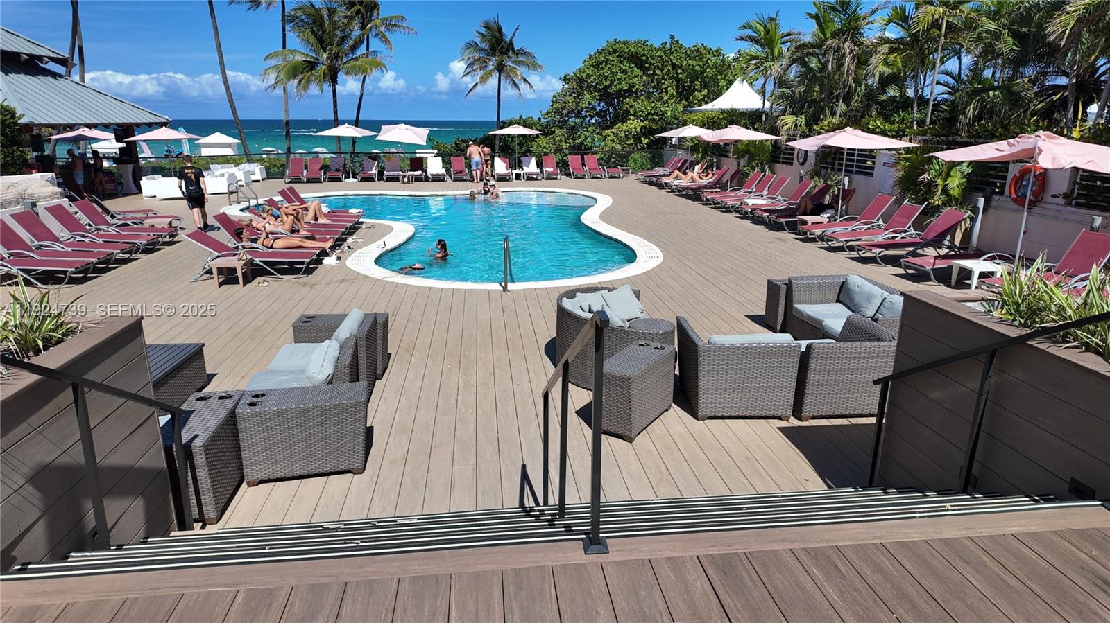 5225 Collins Avenue, Unit 1204 Miami Beach, FL 33140 - Photo 21 of 49 a view of outdoor kitchen with outdoor seating