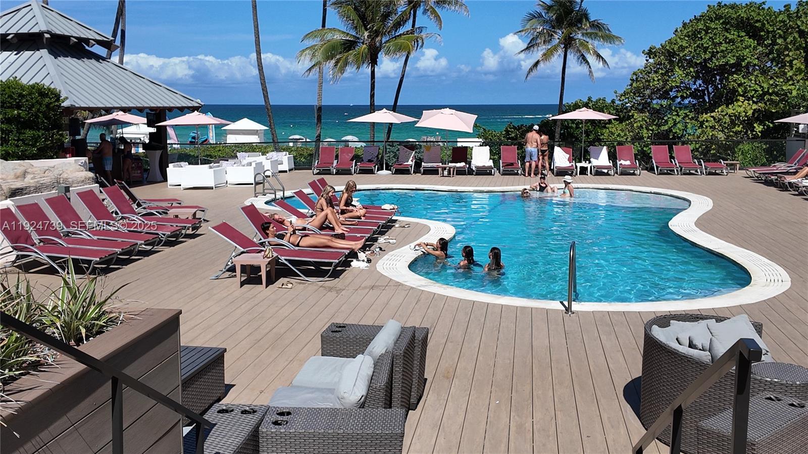 5225 Collins Avenue, Unit 1204 Miami Beach, FL 33140 - Photo 22 of 49 an outdoor space with seating space