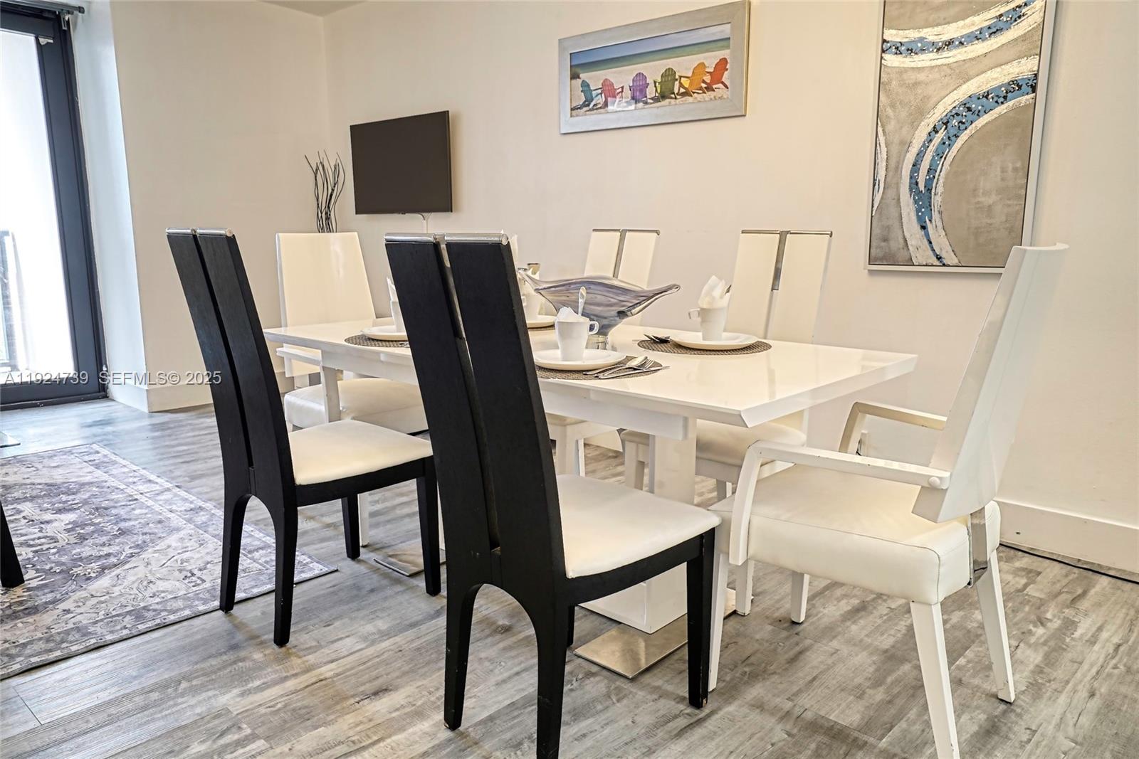 5225 Collins Avenue, Unit 1204 Miami Beach, FL 33140 - Photo 26 of 49 a view of a dining room with furniture