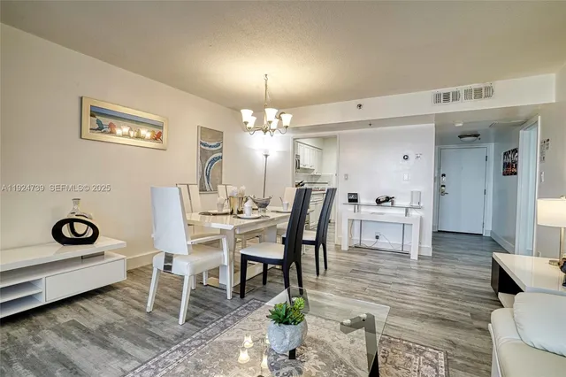 a room with a sink and a wooden floor