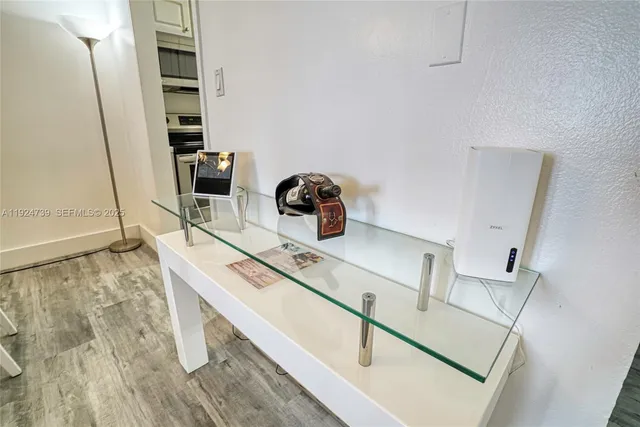 a kitchen with stainless steel appliances a stove a sink and cabinets