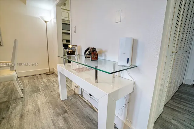 a bedroom with a bed and a couch next to a window