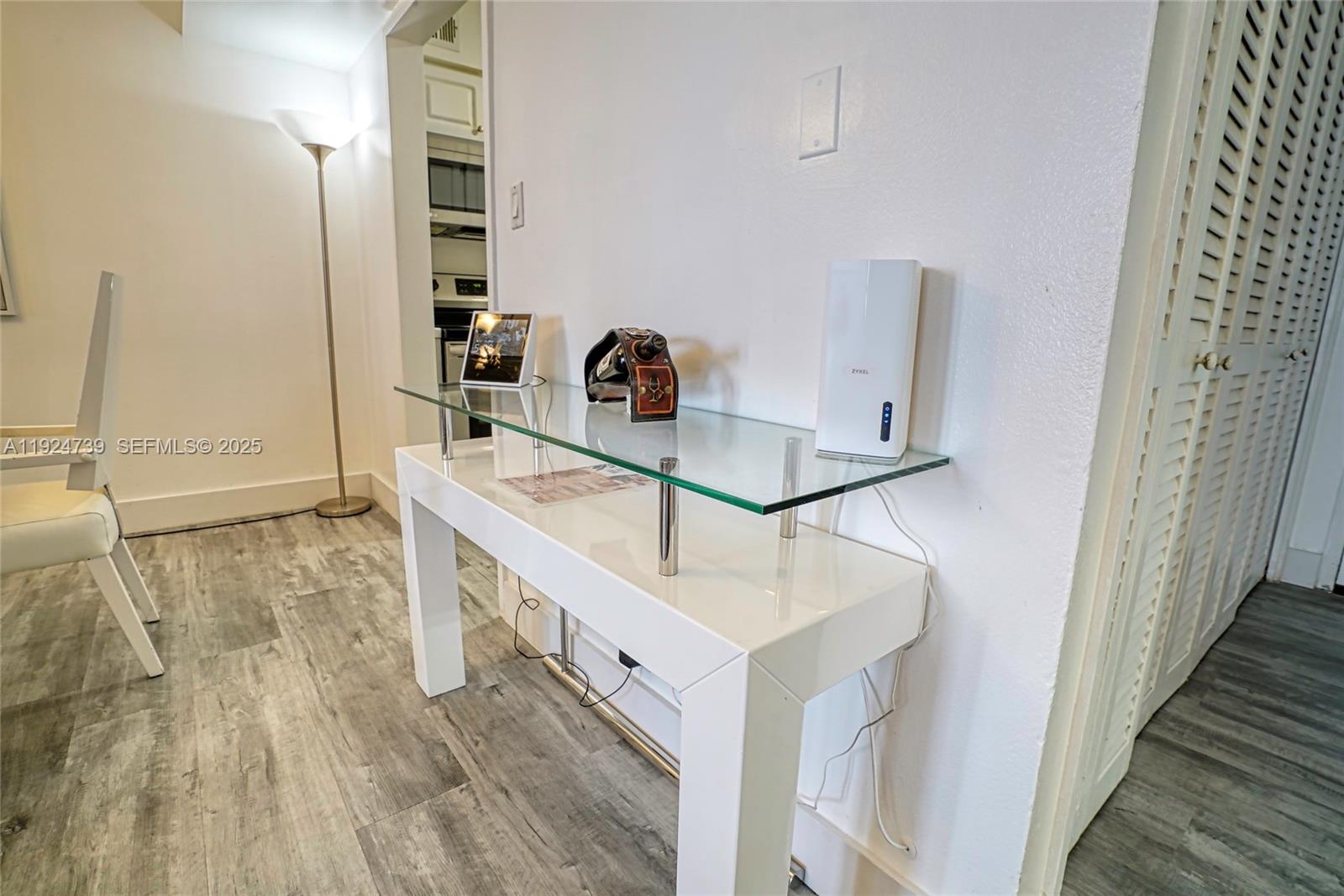 5225 Collins Avenue, Unit 1204 Miami Beach, FL 33140 - Photo 32 of 49 a bathroom with a sink and a mirror