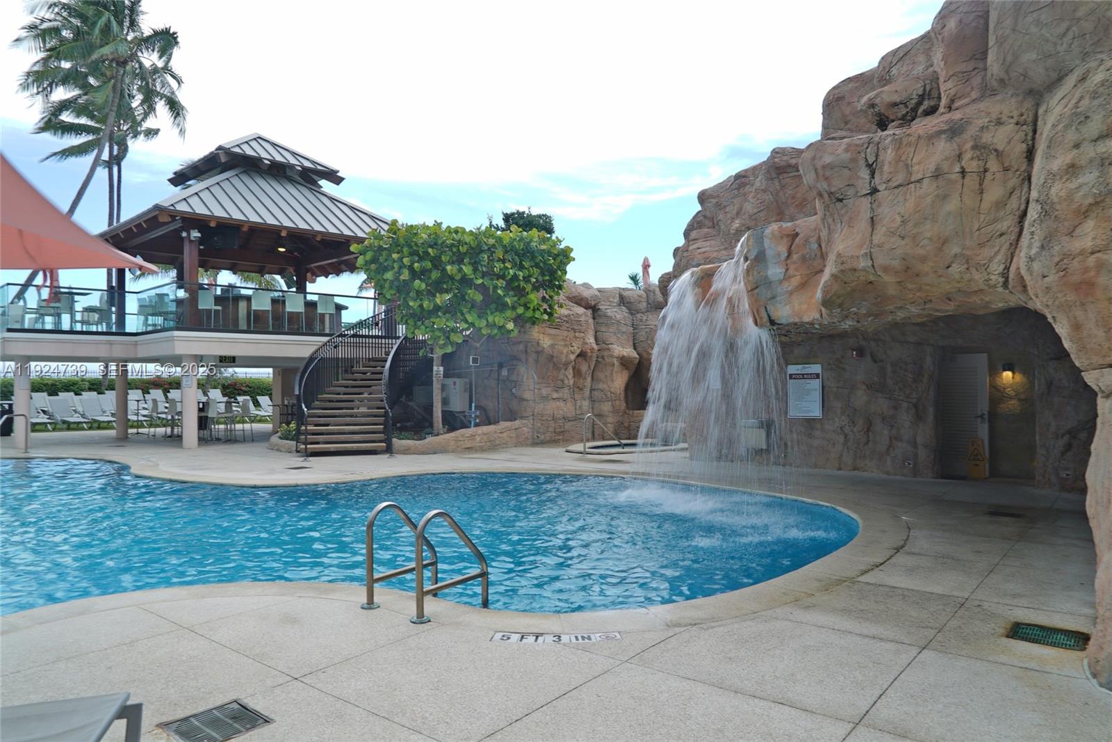 5225 Collins Avenue, Unit 1204 Miami Beach, FL 33140 - Photo 40 of 49 a view of a house with backyard porch and sitting area