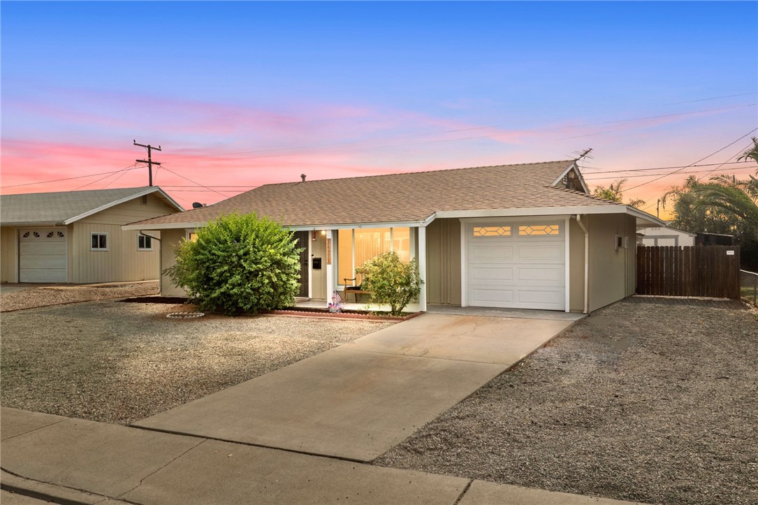 26971 Pinehurst Road Menifee, CA 92586 - Photo 1 of 1 a front view of a house with a yard and garage