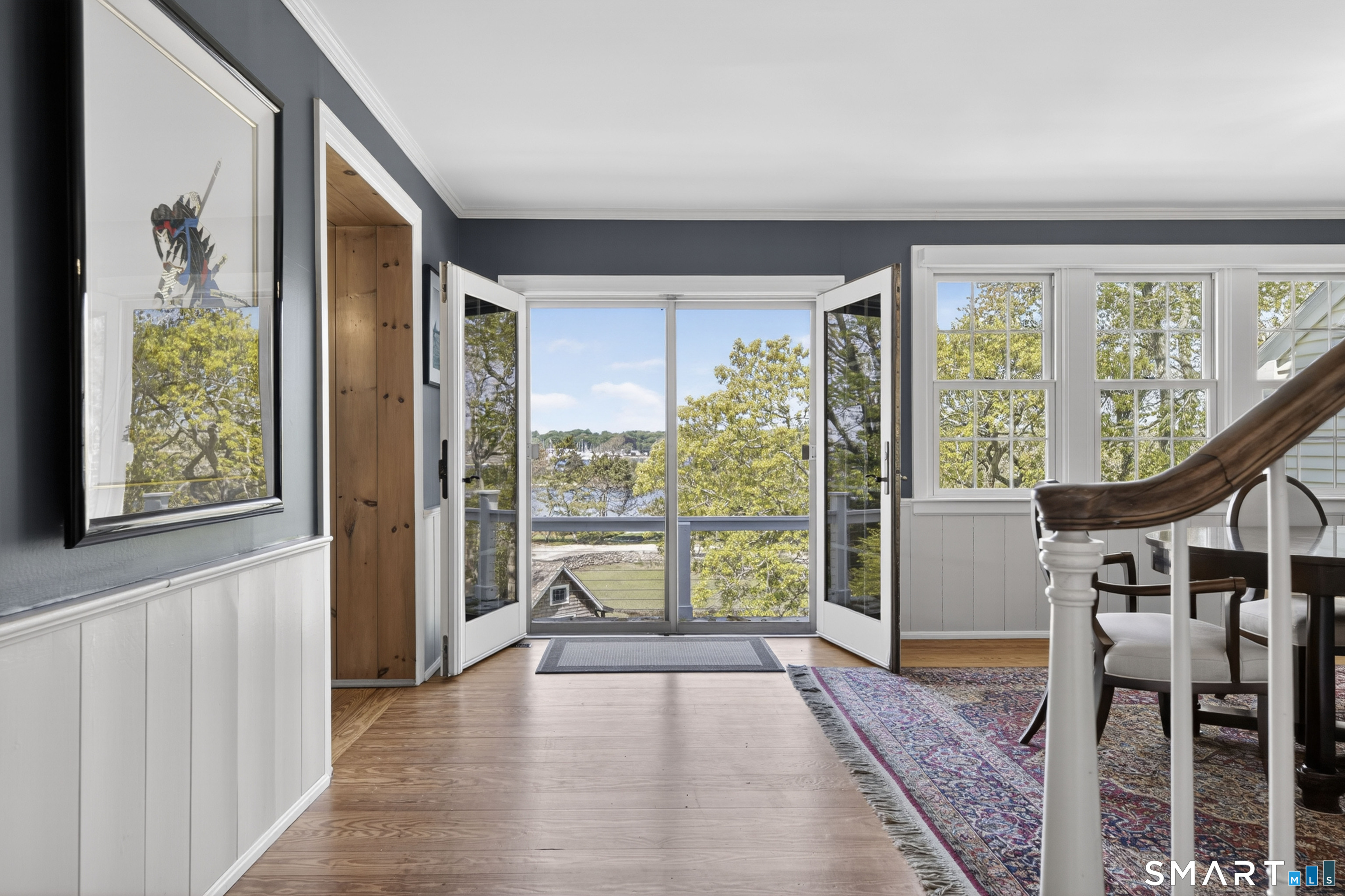 32 Money Point Road Stonington, CT 06355 - Photo 5 of 40 a view of an entryway with wooden floor and door