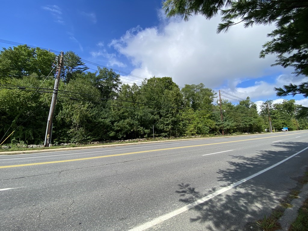 70 South Street Hopkinton, MA 01748 - Photo 2 of 7 a view of a yard with a house