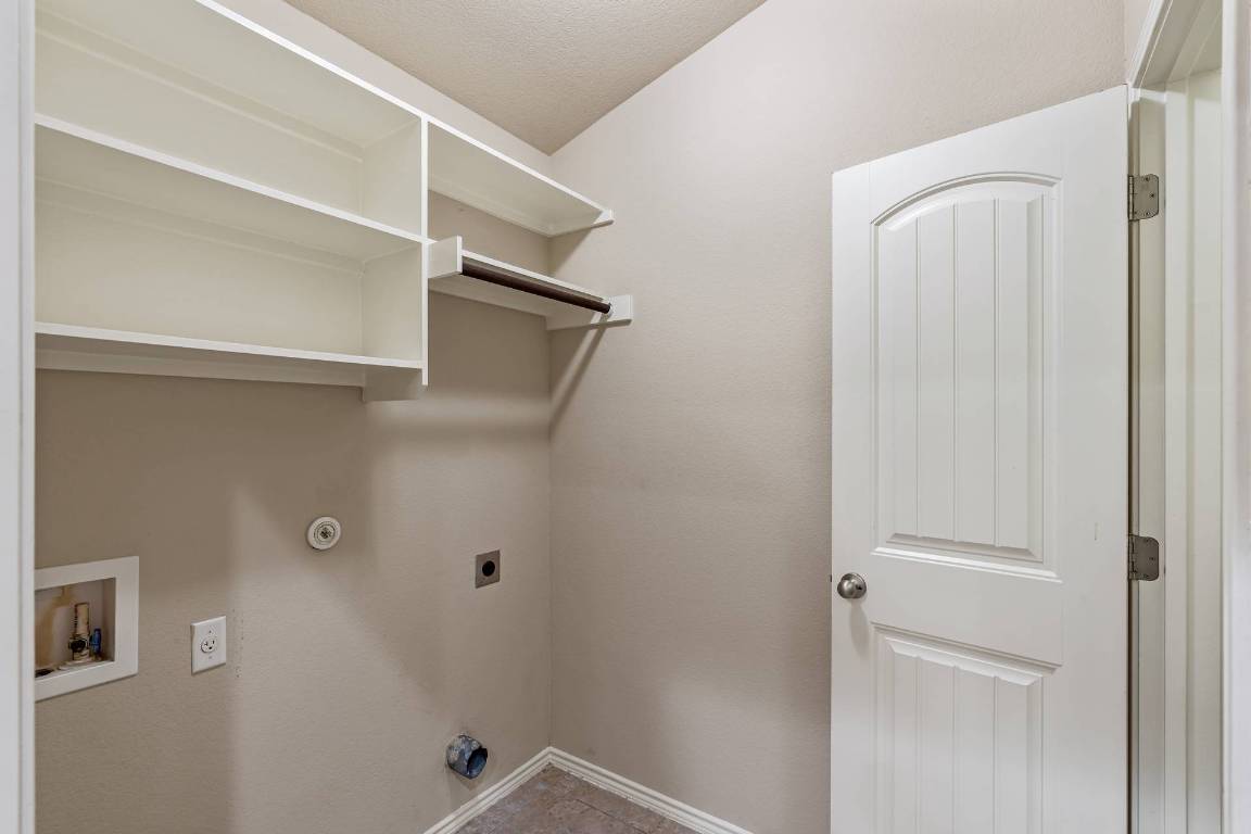 180 Fletcher Bend Buda, TX 78610 - Photo 11 of 36 a bathroom with a shower