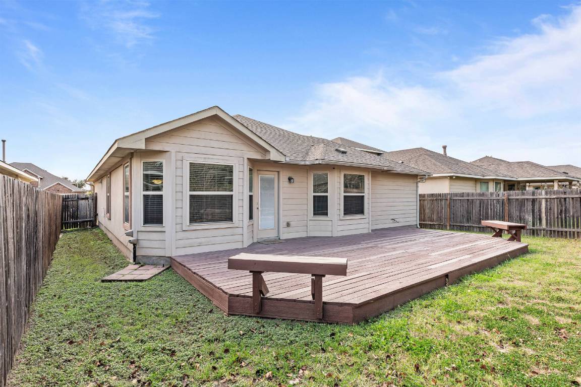 180 Fletcher Bend Buda, TX 78610 - Photo 26 of 36 a view of a house with backyard and porch