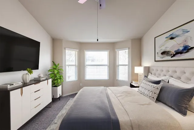 a kitchen with stainless steel appliances granite countertop a refrigerator a stove and a sink with wooden cabinets