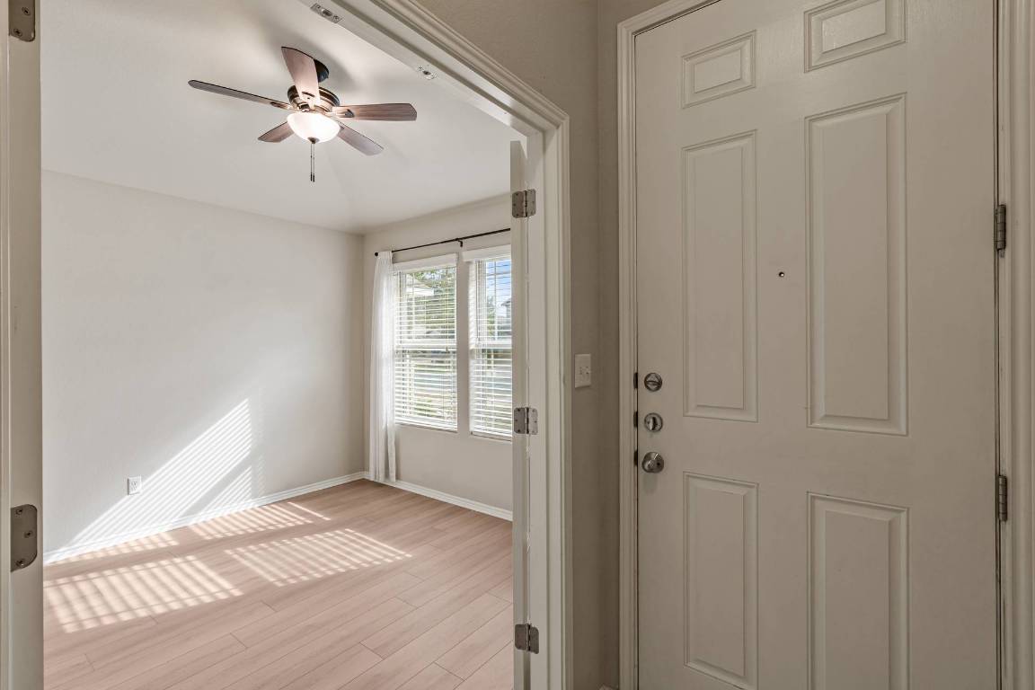 180 Fletcher Bend Buda, TX 78610 - Photo 6 of 36 a view of an empty room with a window