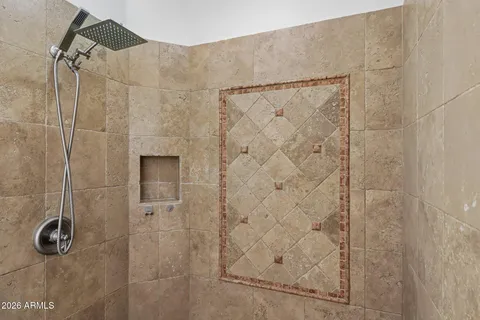 a bath tub sitting in a bathroom next to a window