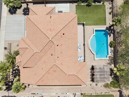 a view of a backyard with swimming pool