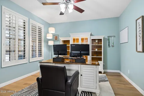 a living room with furniture fireplace and flat screen tv