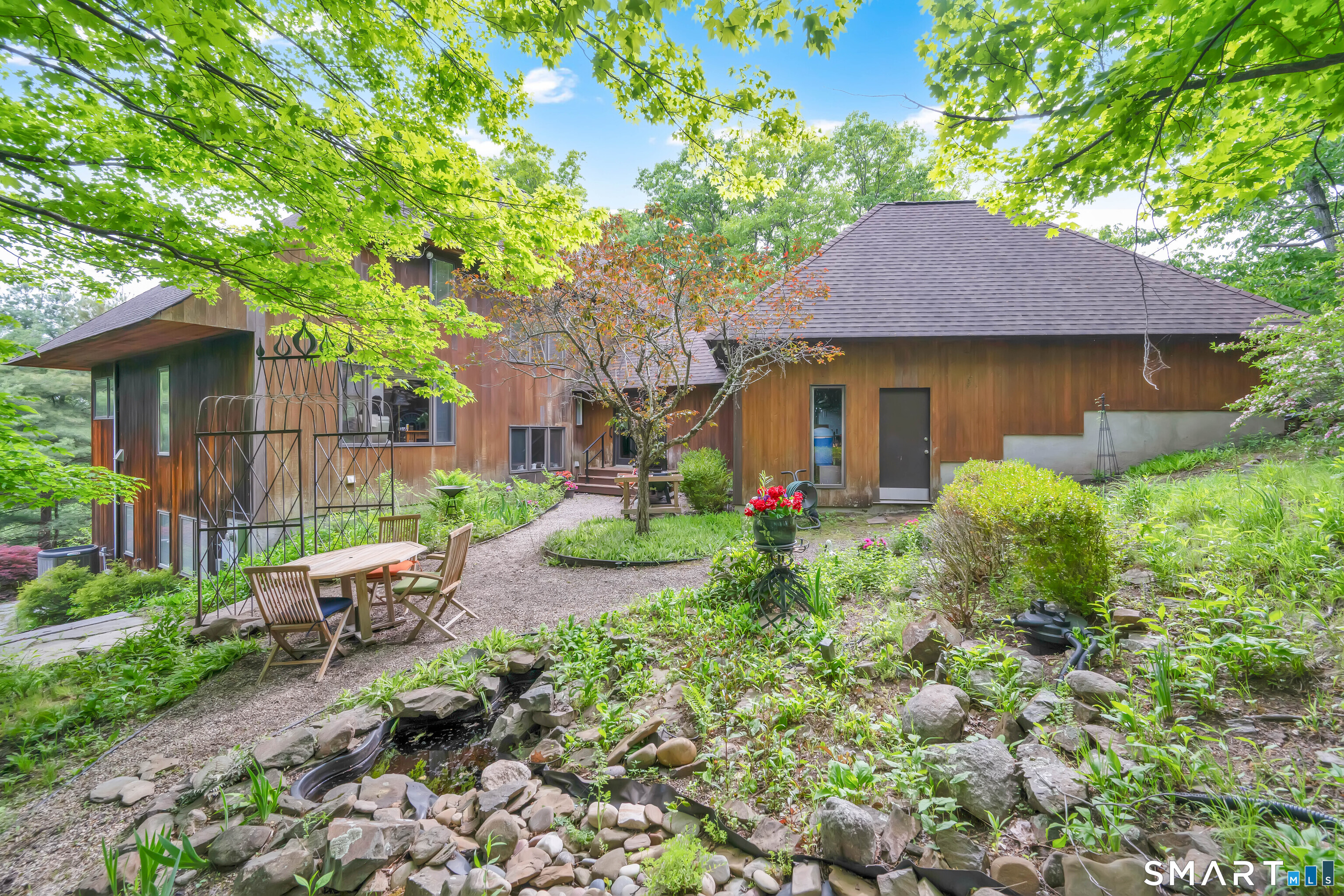 86 Washburn Road Canton, CT 06019 - Photo 33 of 40 a view of a house with a yard and tree s