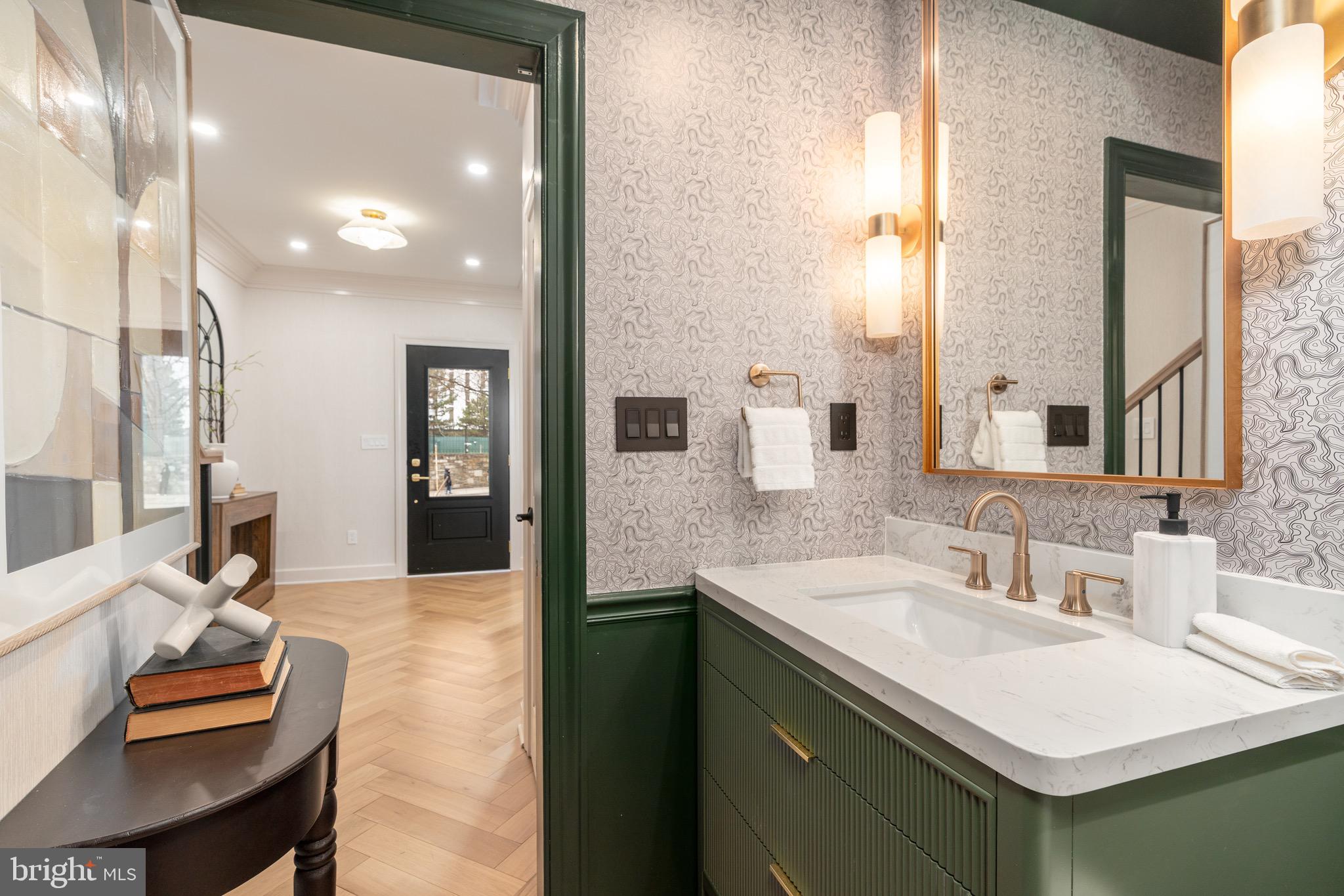 2619 Wisconsin Avenue Northwest Washington, DC 20007 - Photo 21 of 63 a en suite bathroom with a sink and a mirror