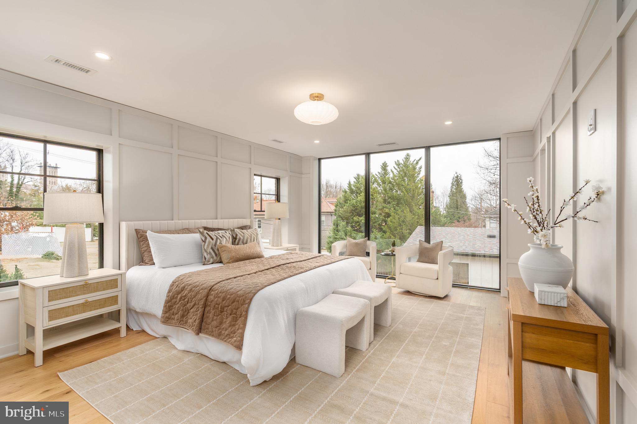 2619 Wisconsin Avenue Northwest Washington, DC 20007 - Photo 23 of 63 a bedroom with a large bed and a large window