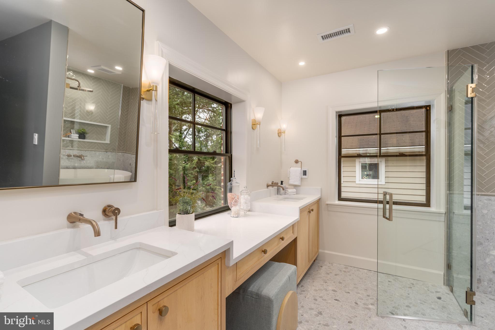 2619 Wisconsin Avenue Northwest Washington, DC 20007 - Photo 26 of 63 a bathroom with a granite countertop sink mirror and double