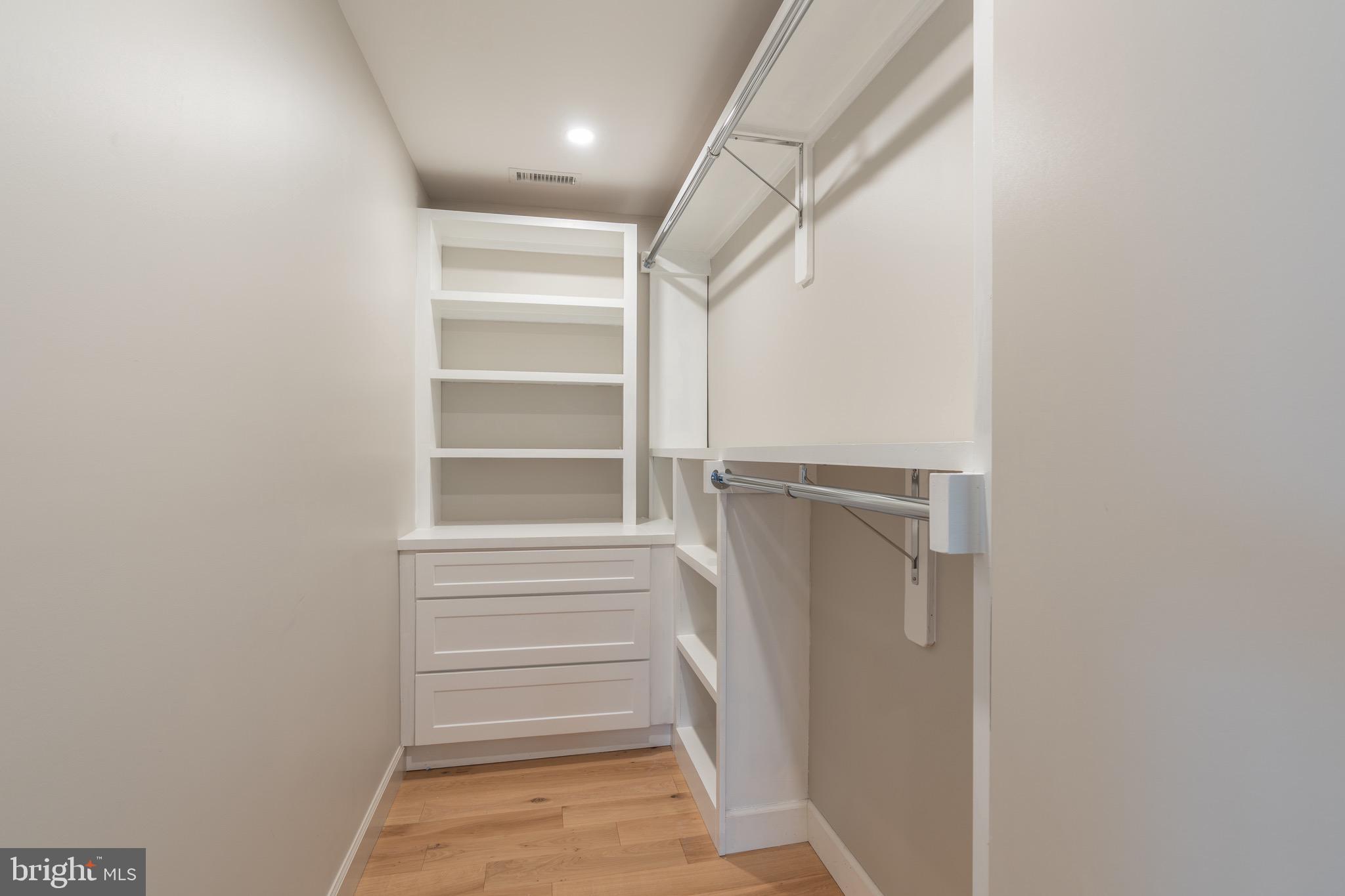 2619 Wisconsin Avenue Northwest Washington, DC 20007 - Photo 29 of 63 a view of walk in closet with empty racks