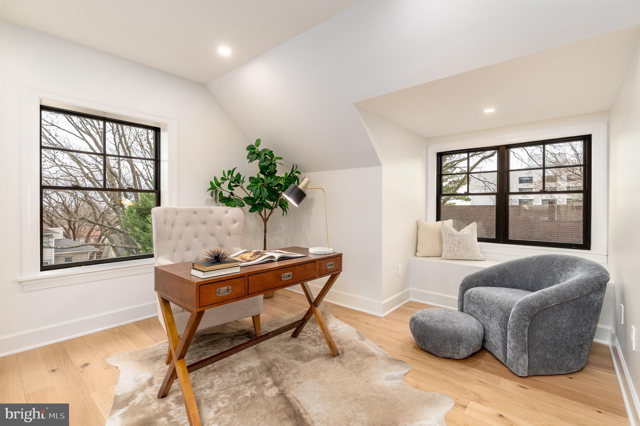 2619 Wisconsin Avenue Northwest Washington, DC 20007 - Photo 34 of 63 a living room with furniture and a window