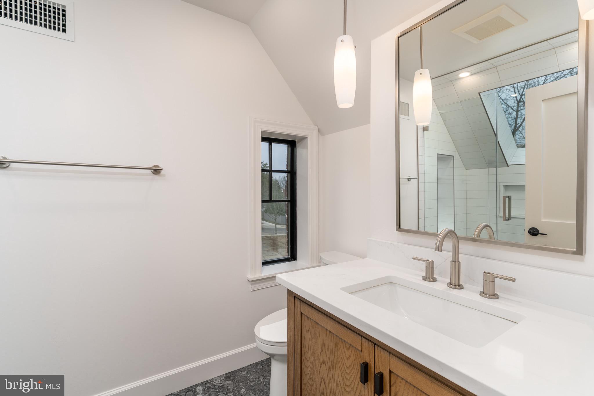 2619 Wisconsin Avenue Northwest Washington, DC 20007 - Photo 38 of 63 a bathroom with a sink and a mirror