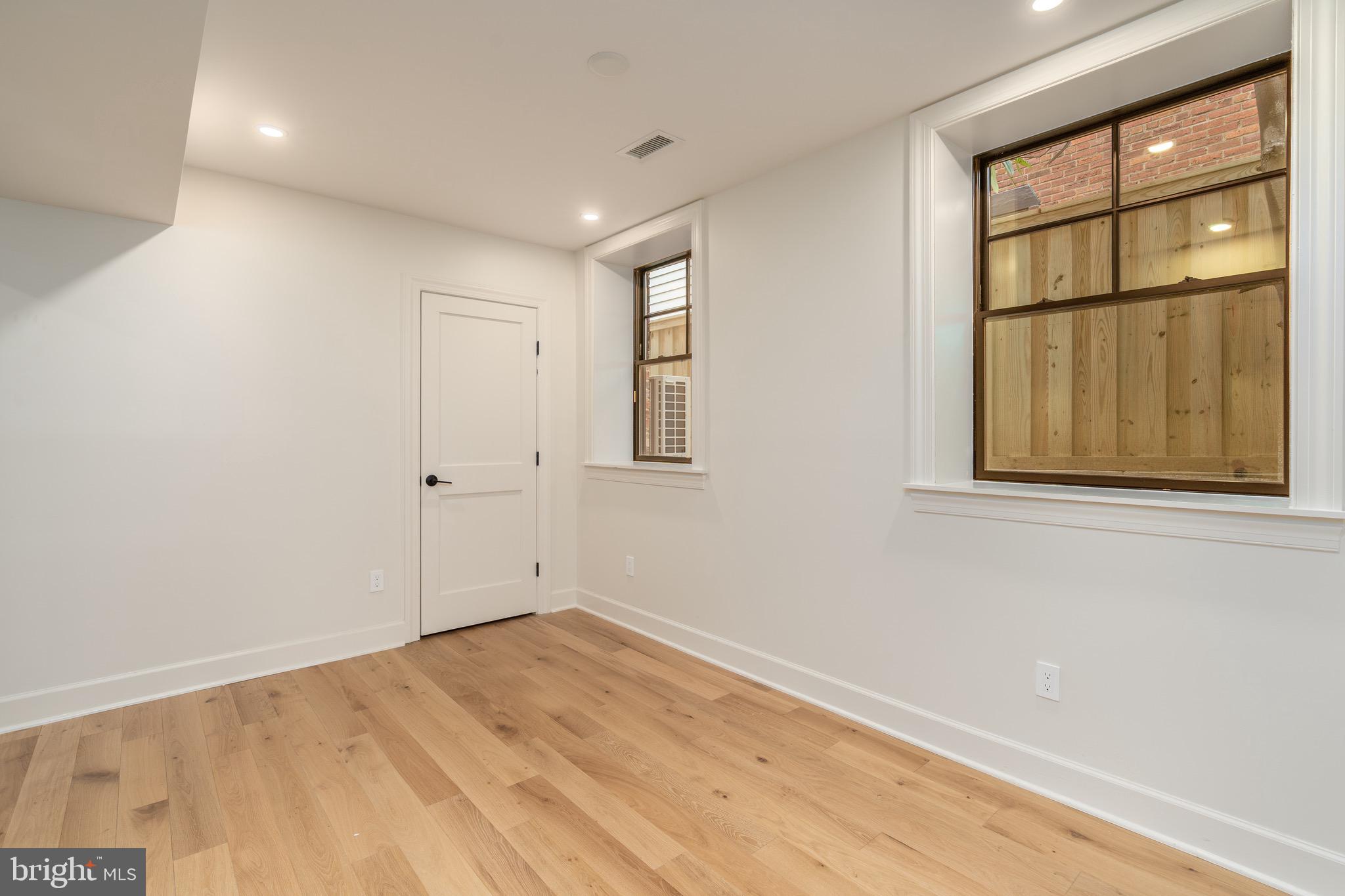 2619 Wisconsin Avenue Northwest Washington, DC 20007 - Photo 51 of 63 wooden floor in an empty room with a window