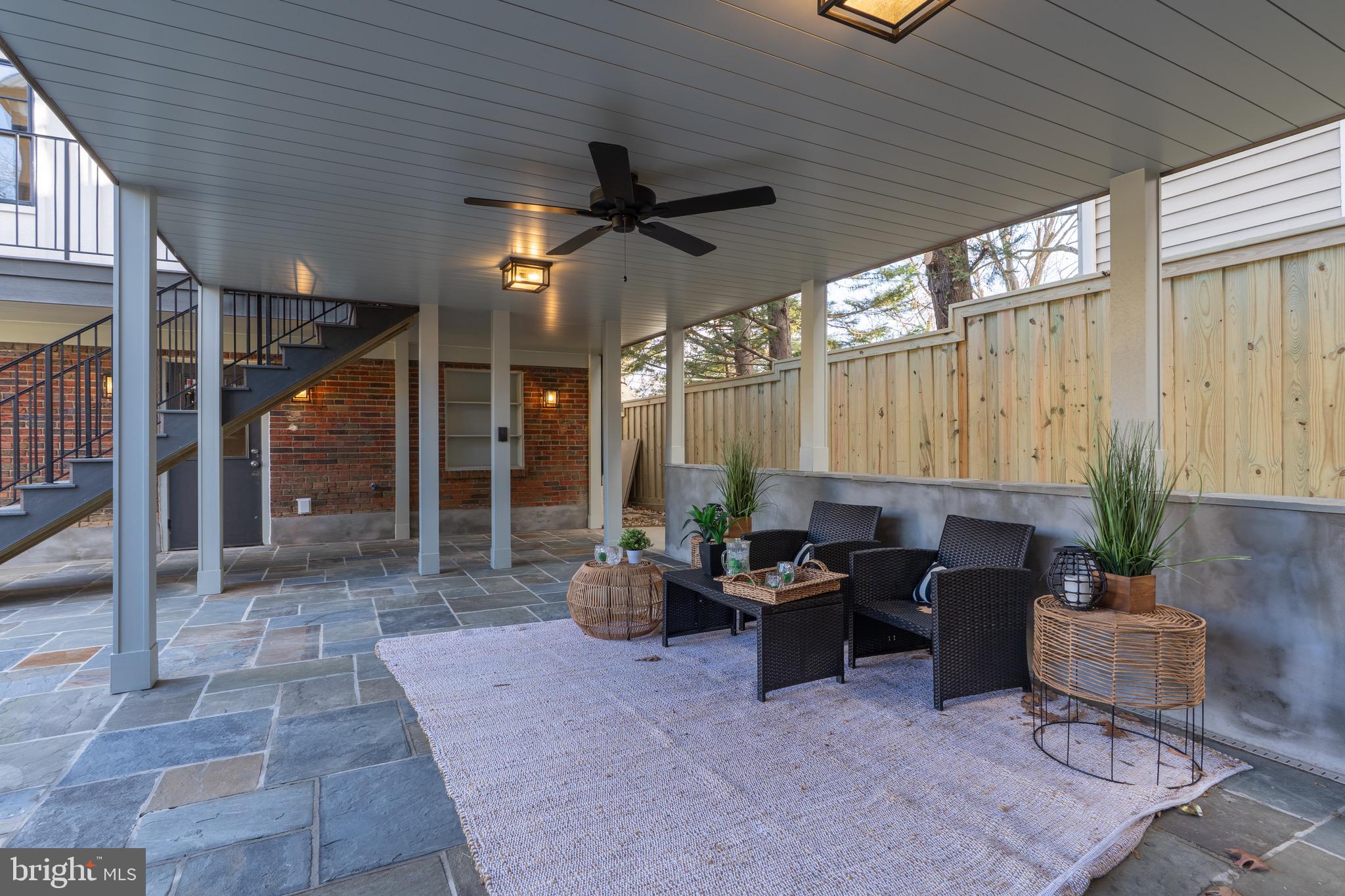 2619 Wisconsin Avenue Northwest Washington, DC 20007 - Photo 54 of 63 a living room with patio furniture and a potted plant