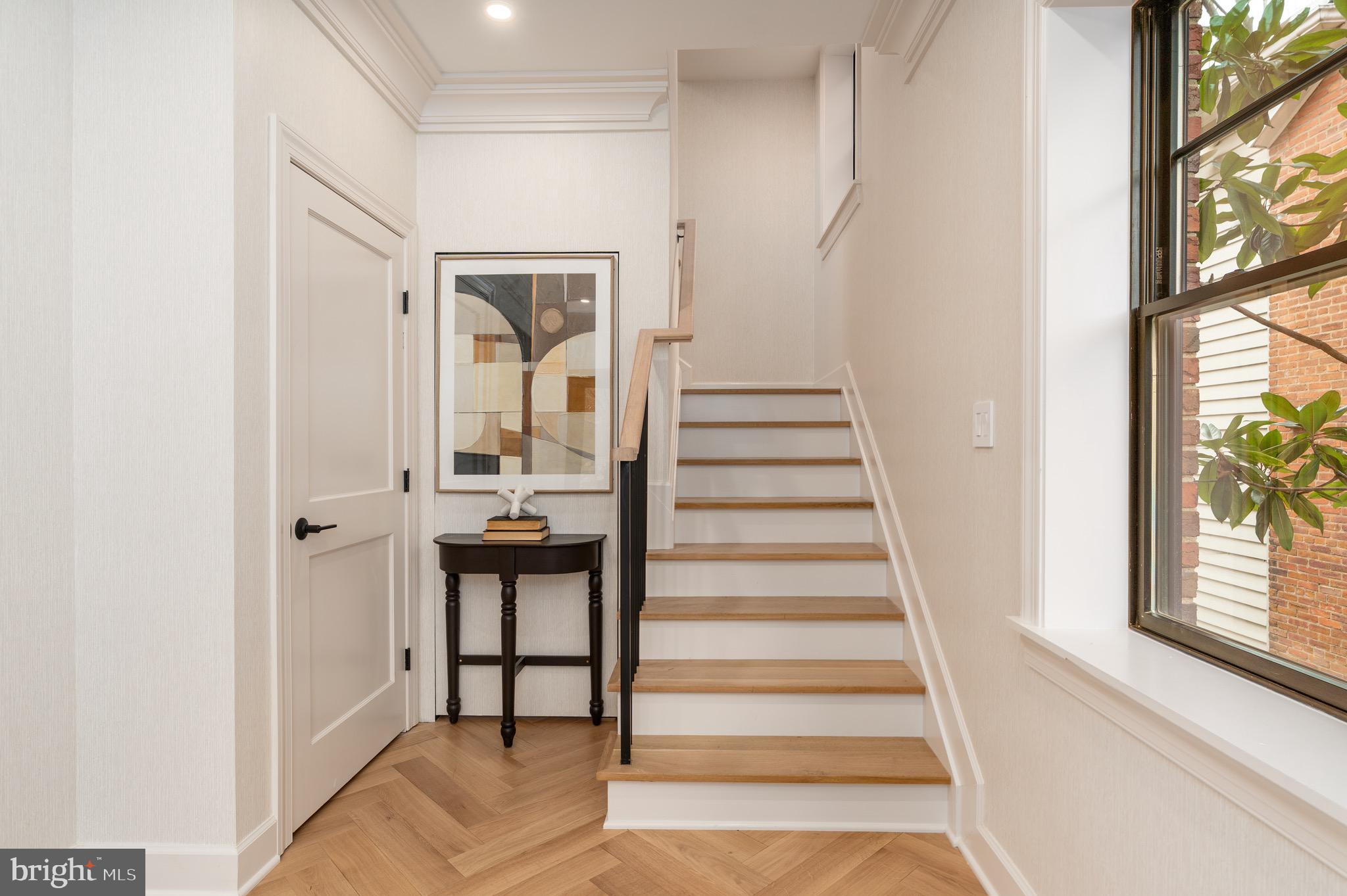 2619 Wisconsin Avenue Northwest Washington, DC 20007 - Photo 6 of 63 a view of a hallway with wooden floor and windows