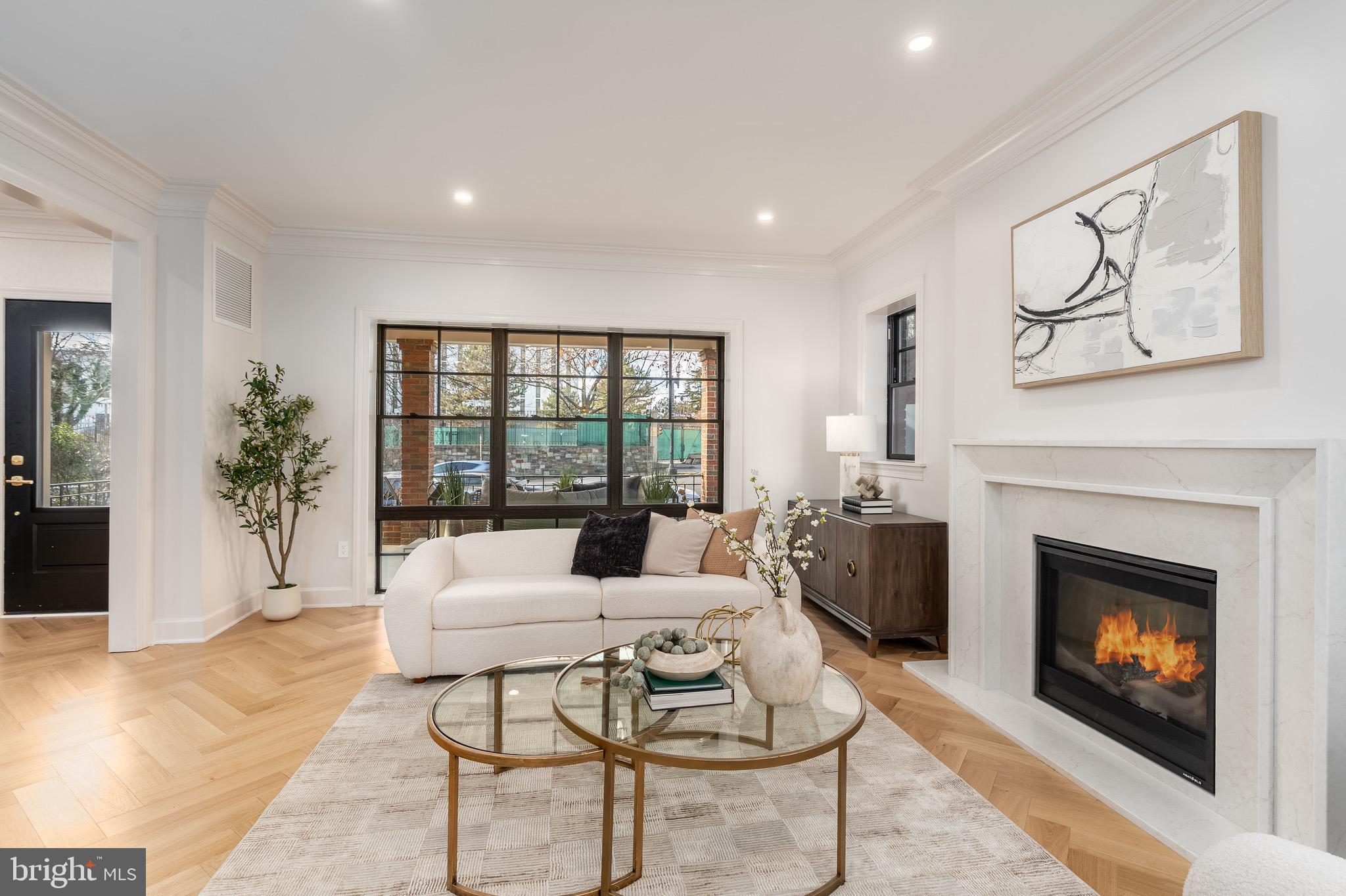 2619 Wisconsin Avenue Northwest Washington, DC 20007 - Photo 8 of 63 a living room with furniture and a fireplace