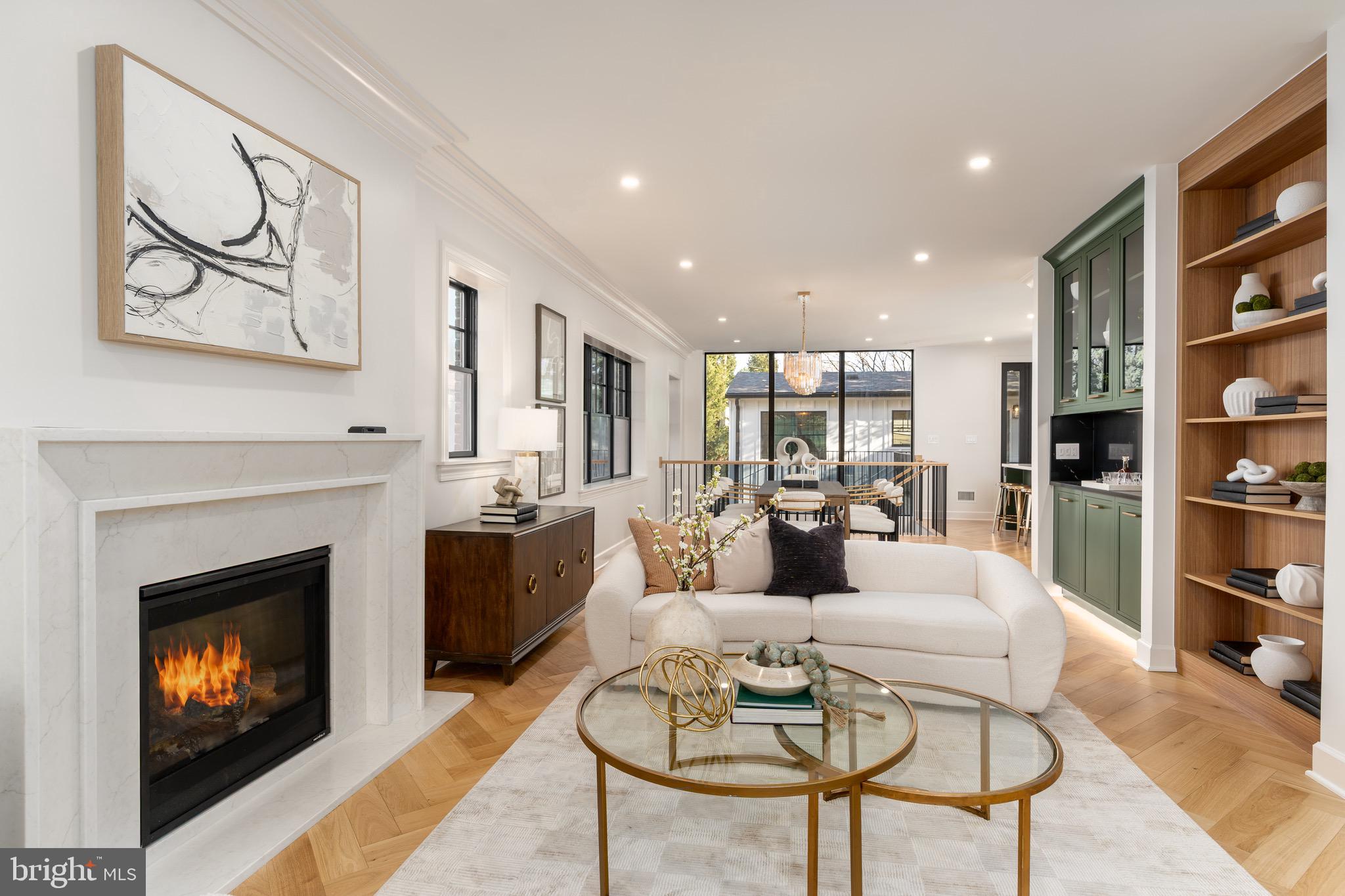 2619 Wisconsin Avenue Northwest Washington, DC 20007 - Photo 9 of 63 a living room with furniture and a fireplace