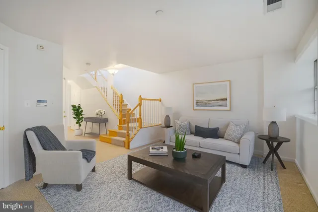 a view of an empty room with stairs