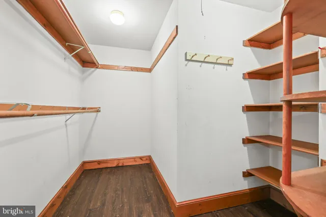 a bathroom with a sink a toilet and a large mirror