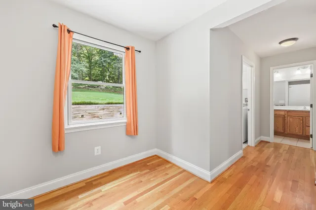 a view of washer and dryer with kitchen in the background