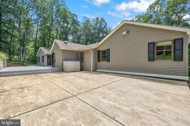 a view of a house with a yard and plants