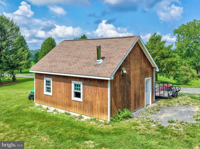 a view of a green field with lots of bushes