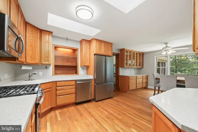 a view of kitchen with furniture and wooden floor