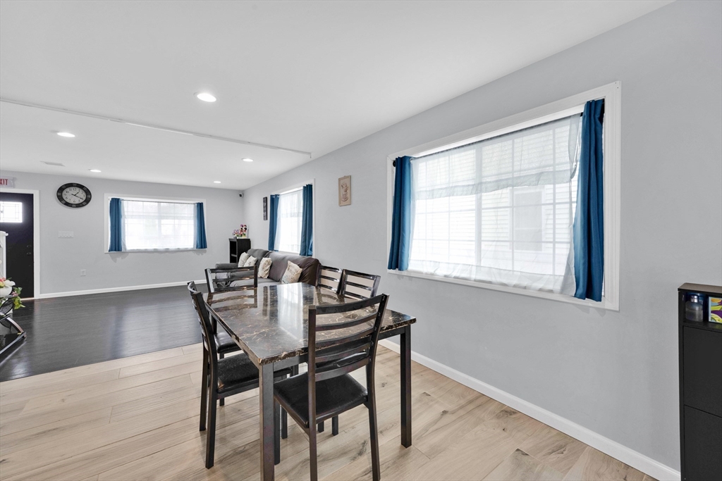 42 Ringgold Street Springfield, MA 01107 - Photo 12 of 38 a view of a dining room with furniture and wooden floor