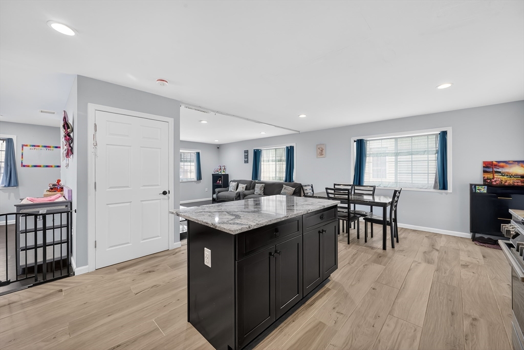 42 Ringgold Street Springfield, MA 01107 - Photo 15 of 38 a kitchen with a sink cabinets and wooden floor