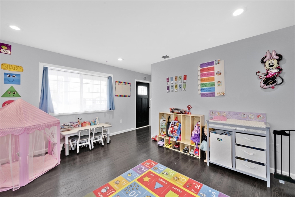 42 Ringgold Street Springfield, MA 01107 - Photo 18 of 38 a room with furniture and a wooden floor