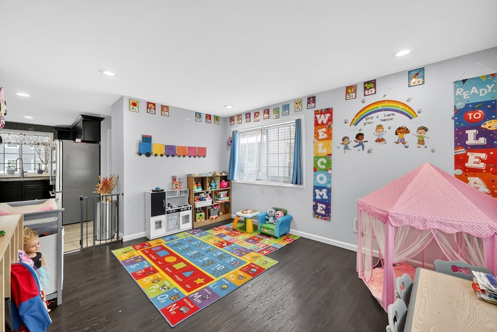 42 Ringgold Street Springfield, MA 01107 - Photo 20 of 38 a room with furniture and a baby crib