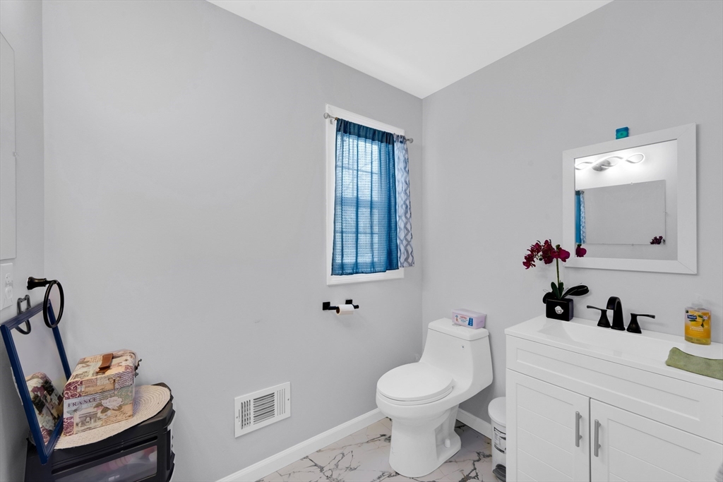 42 Ringgold Street Springfield, MA 01107 - Photo 21 of 38 a bathroom with a sink toilet and a mirror