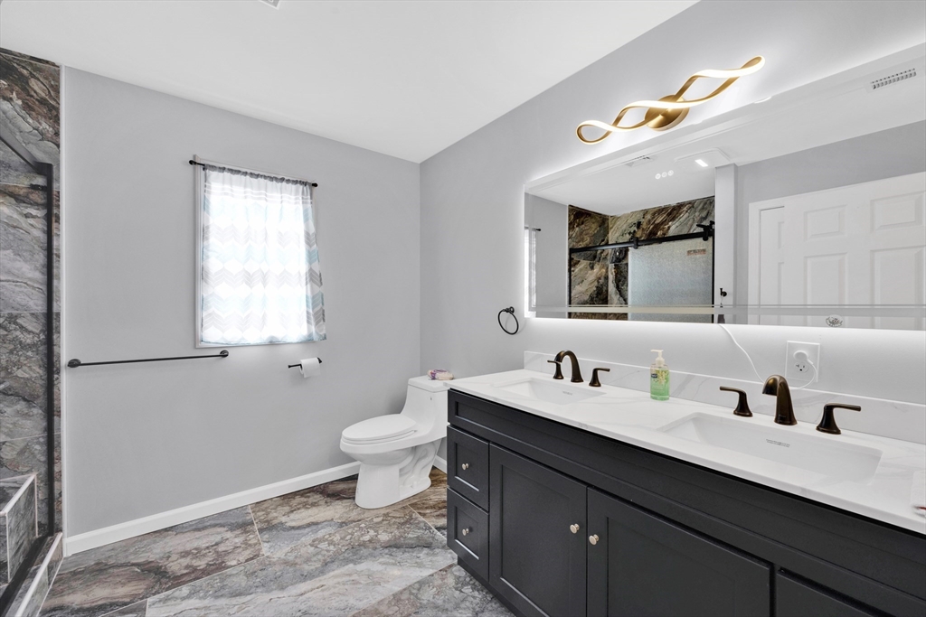 42 Ringgold Street Springfield, MA 01107 - Photo 23 of 38 a bathroom with a sink vanity granite and toilet