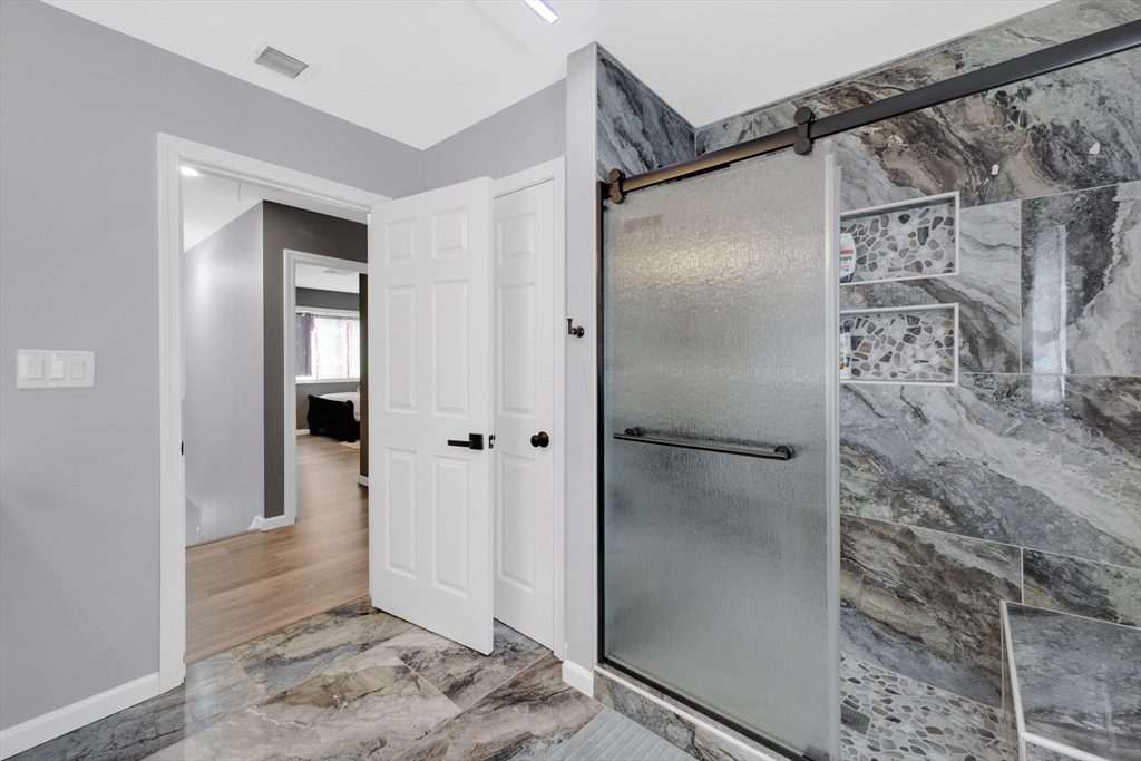 42 Ringgold Street Springfield, MA 01107 - Photo 24 of 38 a bathroom with a shower and a glass door
