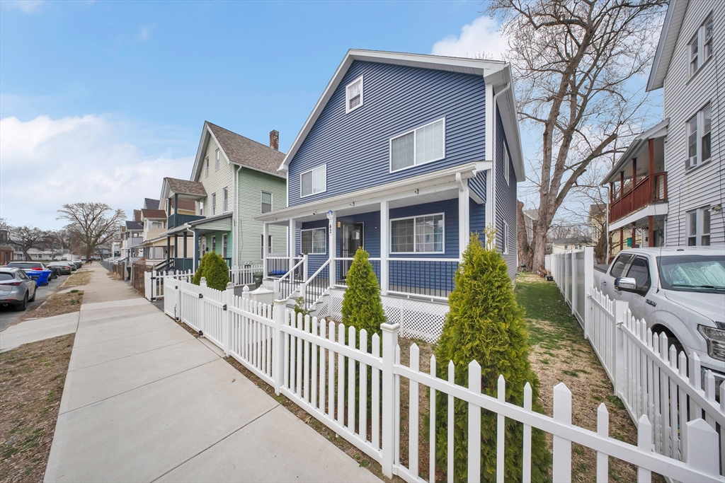 42 Ringgold Street Springfield, MA 01107 - Photo 3 of 38 a view of a brick house with large windows