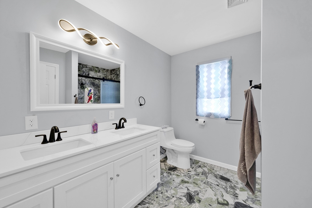 42 Ringgold Street Springfield, MA 01107 - Photo 31 of 38 a bathroom with a sink and a mirror