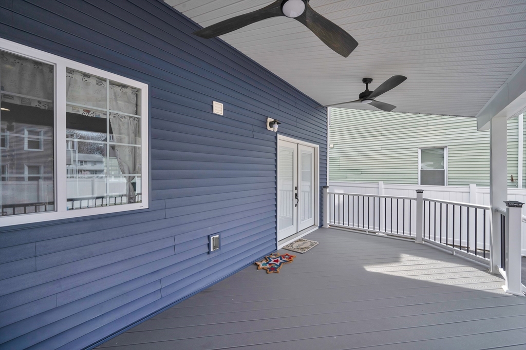 42 Ringgold Street Springfield, MA 01107 - Photo 37 of 38 a view of a porch with wooden floor and fence