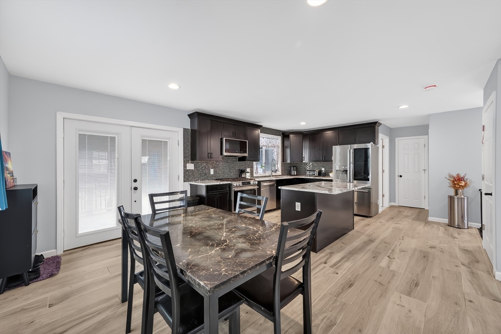 42 Ringgold Street Springfield, MA 01107 - Photo 10 of 38 a view of a dining room with furniture and wooden floor