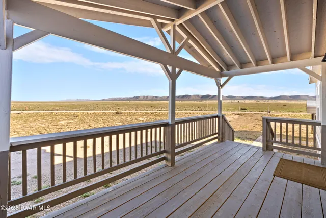 a view of a balcony with wooden floor