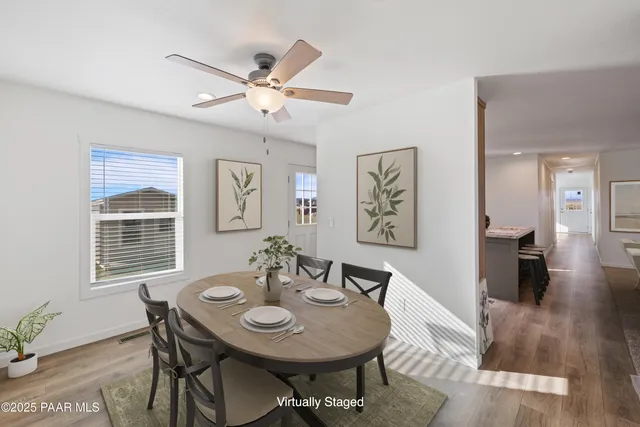 a kitchen with a sink stainless steel appliances and white cabinets